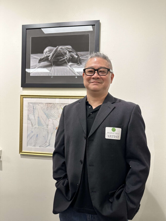 allan-cich-standing-next-to-photographic-artwork-at-paa